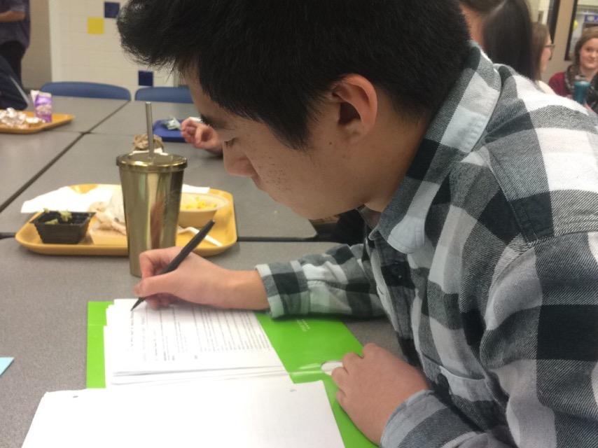 TechHOUNDS member and senior Stanley Liu takes notes on robot coding.  The team meets 5 days a week: Monday,Wednesday and Friday 3:30-6:30 and Tuesday and Thursday 6-9. PHOTO/ JESSICA TAO