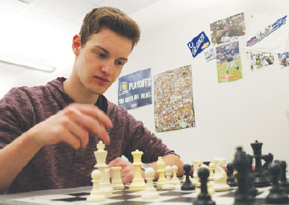 MORE THAN JUST A NUMBER: Senior Joe Philleo plays chess at Chess Club. Philleo said he hopes the college he ends up going to will have many opportunities to play chess both competitively and for fun. VISHNU VAID // PHOTO


