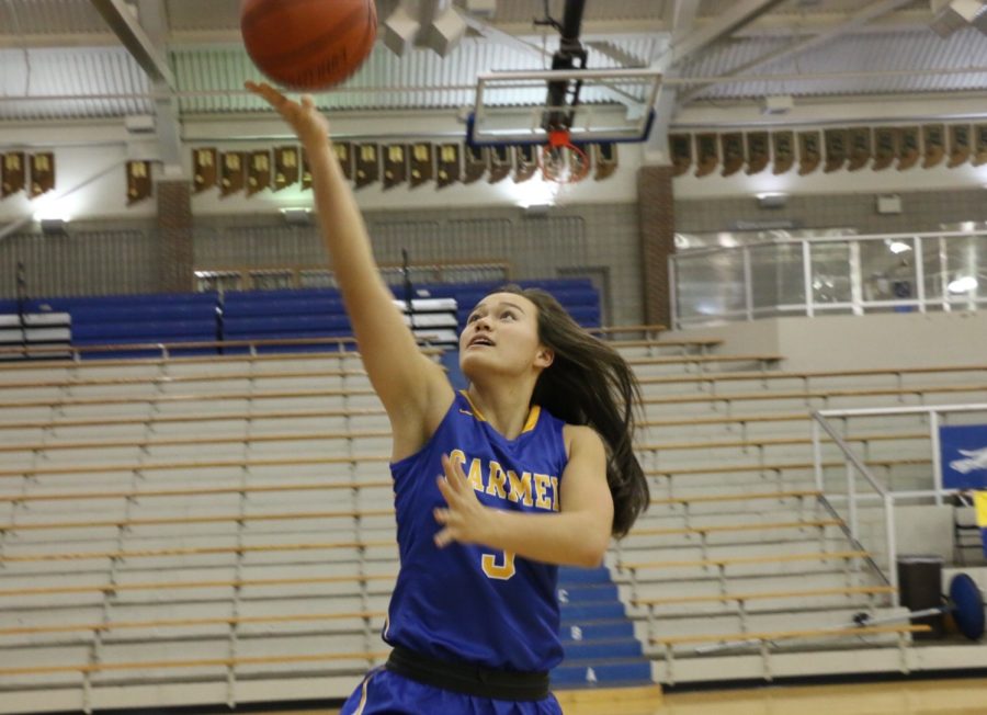TAKING IT TO THE HOOP: Varsity basketball player and senior Celene Funke prepares for lay-up. Funke and the rest of the womens basketball team will play their senior night game tonight against Jay County. MIKE JOHNSON / PHOTO