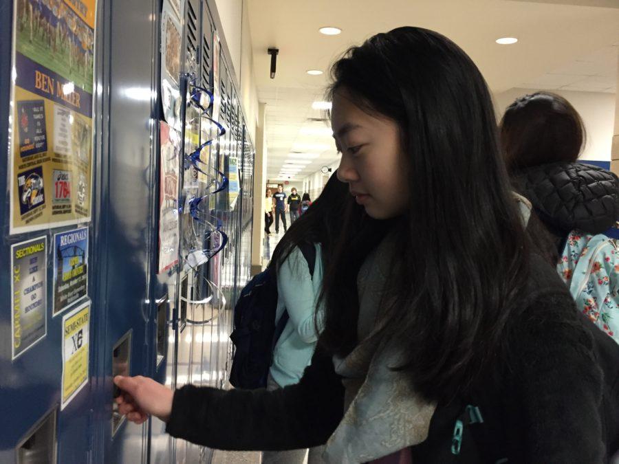 Chelsea Dai, president of Typography and Design Club and sophomore, opens her locker. She said this fundraiser is a good idea because it targets a charity that does not receive as much attention. CHELSEA DAI// PHOTO