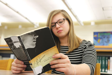 PUTTING THE PAST BEHIND:
Sophomore Catherine Baker reads as a hobby. Baker said while the cyberbullying she experienced left mostly emotional memories,  she immerses herself in activities she enjoys to avoid dwelling on the incident.
SARAH LIU // Photo