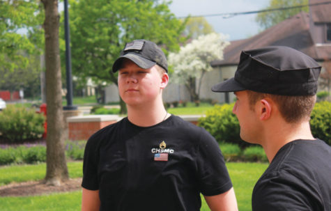 MAJORING IN THE MILITARY:
Zach Rogers, Military Club member and senior, stands during a Military Club meeting while former club officer, Joseph “Joe” Fletcher ‘16 watches on. Rogers said his parents are proud of him for wishing to join the Marines.
NYSSA QIAO // PHOTO