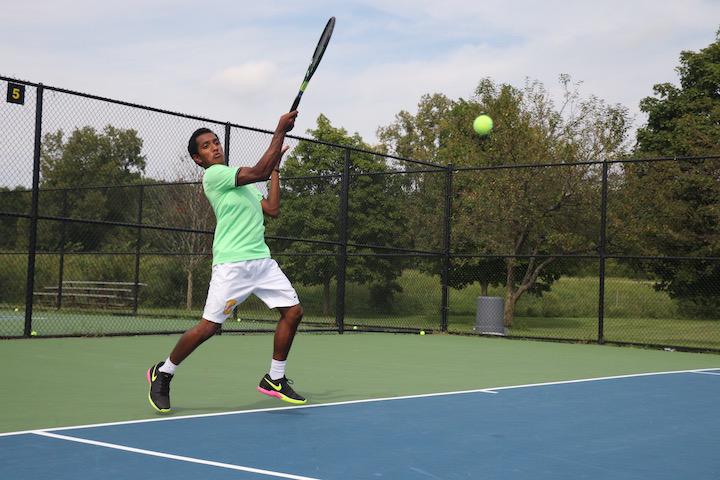 Nikhil Palde, JV player and sophomore, is warming up at practice. The boys tennis team is hosting and looking to win their Sectional at the Todd Witsken Tennis Center on Sept. 28, 29, and Oct. 1.