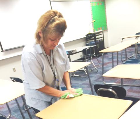 CHS custodian Susie Denson doing what she does best in Family Consumer Science room after school.