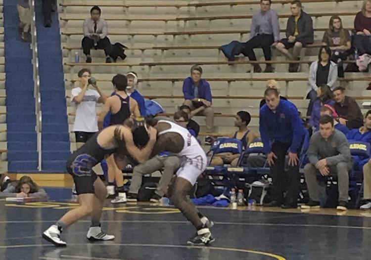 Senior Eric Boleman faces an opponent fromLawrence North High School. CHS won the match 39-19. 