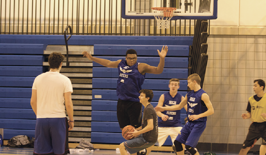 NOT IN MY HOUSE:
Sophomore Caleb Shaffer rises to block an opposing player during an intramural game. He said he prefers intramural since he is allowed to choose his teammates.