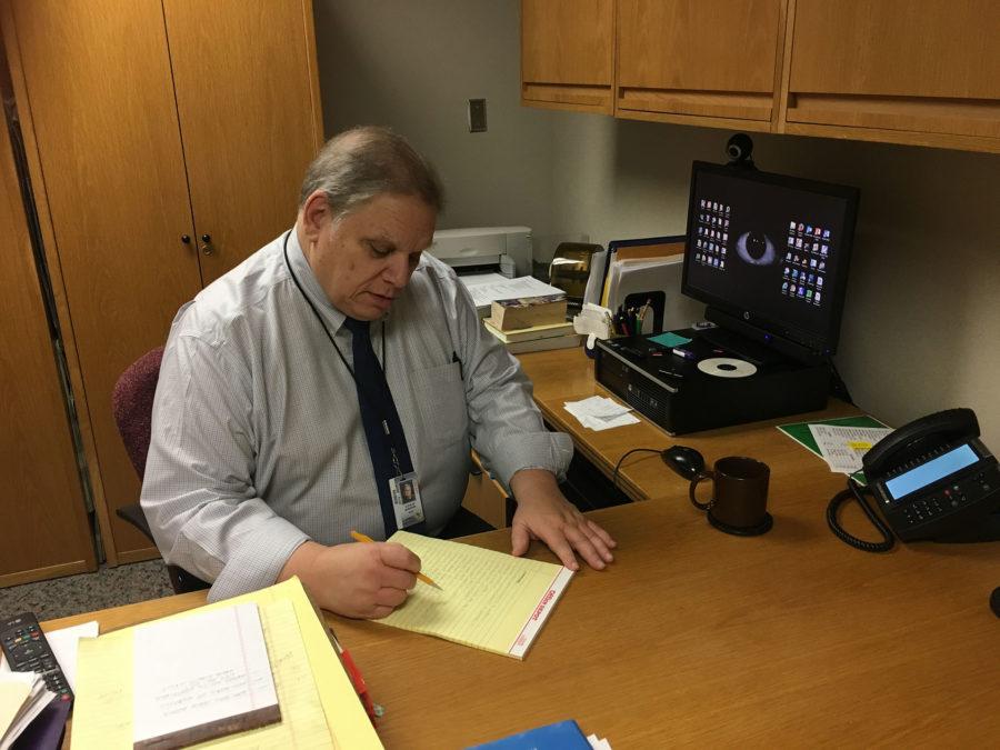 A.C.T. coach John Shearin sits at his desk after looking over some of statistics on the A.C.T. He said he has enjoyed being the coach of the team for years, and is retiring at the end of the school year. 