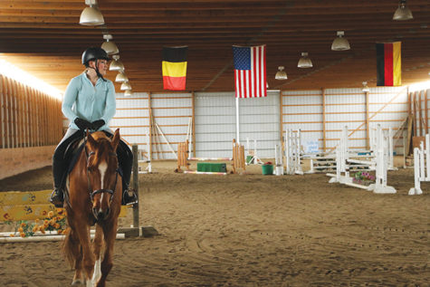 Junior Evie Heffern trains with her horse, Casmir, in preparation for a competition. Heffern has been riding horses for six years.