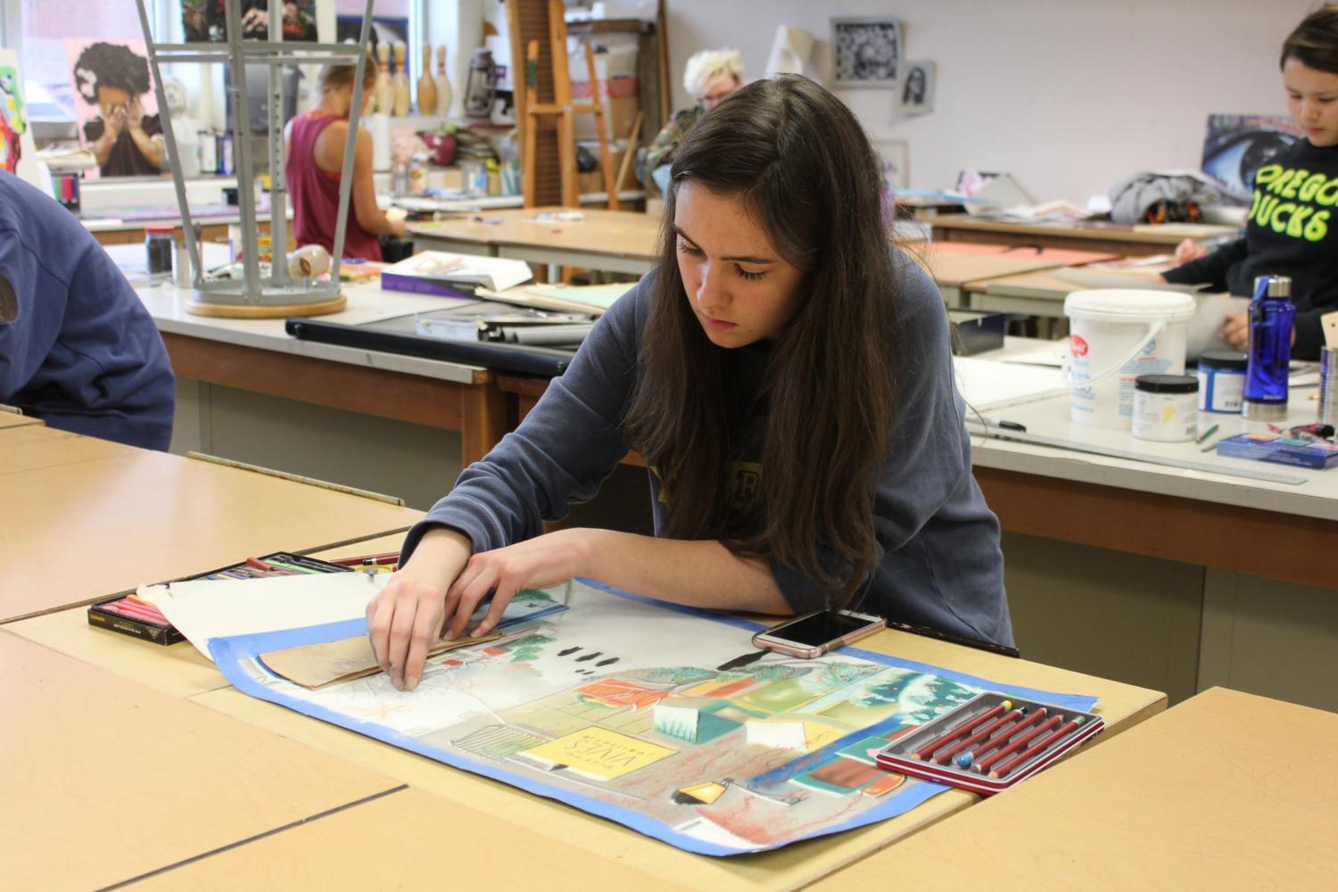 Junior Alyssa Easton works on an art piece during SRT. Bubp said the spring art show will feature a variety of art work . The Carmel Arts Council will jury this show and select best works among all four grade levels.