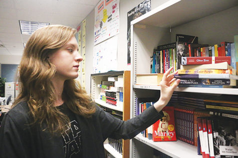 Junior Genevieve Zircher finds a book to read during class. Zircher said she identifies herself as a democratic socialist; however, although the U.S. has some democratic socialist policies, other people consider democratic socialism  as a radical thought.