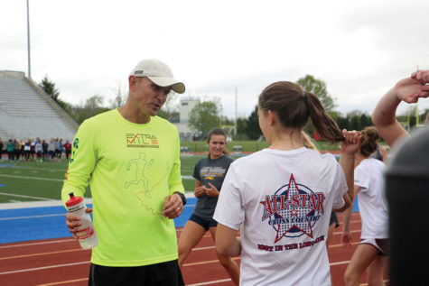 Real Talk: 
Head Coach Andy Dalton discusses recovery and training with senior and varsity runner Corrine Miller. Miller believes Dalton will bring many effective ideas to the program.