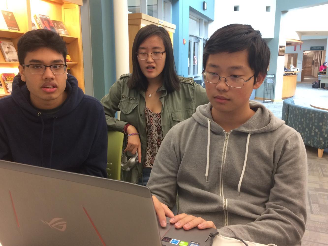 Seniors Aakash Roy, Catherine Qing
 and Kevin Chen (left to right) use Canvas to complete their homework during SRT. Chen said although more could be done to improve the integration of Canvas, he prefers it over previous platorms, such as Edmodo and Moodle.
