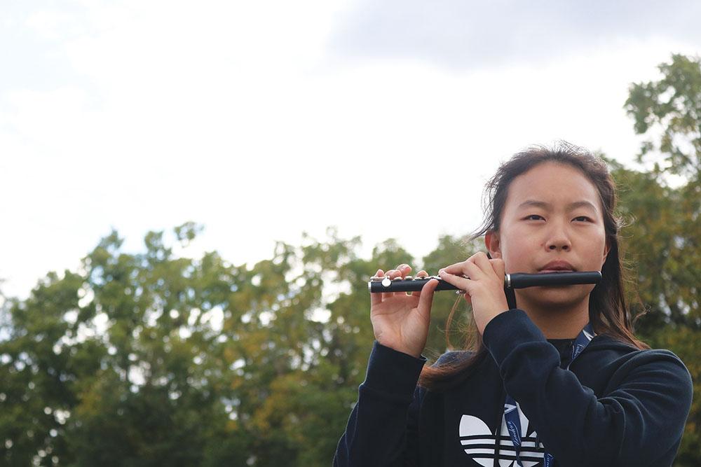 Freshman Connie Zhang plays piccolo for the marching band. She said she started playing in third grade. 
