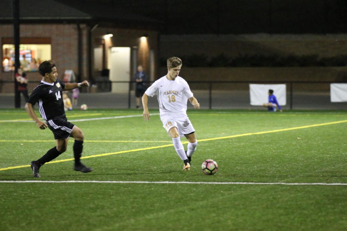 Jack Gerrard, varsity soccer player and junior, plays in a game against Warren Central on Sept. 14. Carmel won the game against Warren Central 3-0.