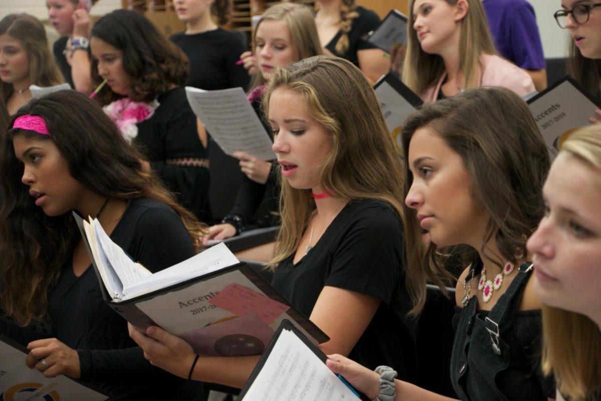 Senior Kennedy Gallagher reads and sings her music at Accents rehearsal. Working since the summer, the Accents have been preparing for their upcoming fall concert on Oct. 4 at 7 p.m. in the CHS auditorium.