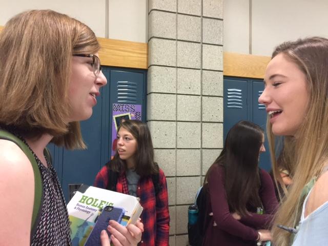 Senior Kendall Fahey converses with fellow senior Anna Prall in the morning before first period. According to Fahey, the PTO helps to facilitate a collective environment at CHS by creating events that allow for students to interact with their peers outside of the classroom. 