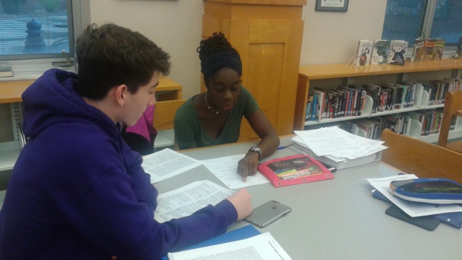 Seniors Nick Schipp and Oti Ogbeide discuss their AP Macroeconomics work. Schipp said the new suicide prevention and awareness policy the board will discuss in November was relevant and possibly beneficial to students.