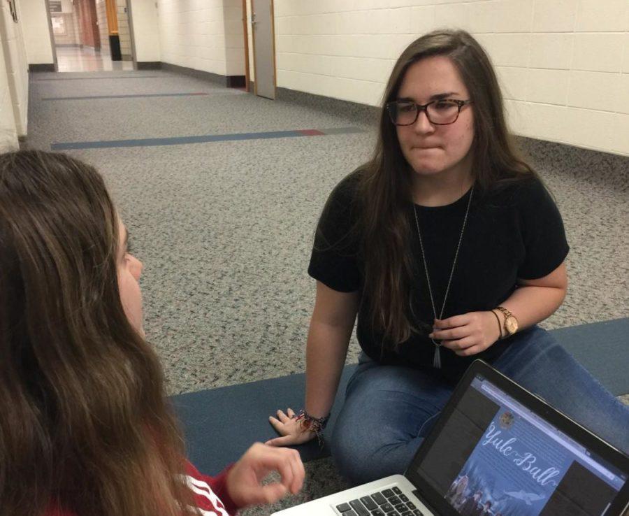 Abby Carmichael, Teen Library Council vice president and sophomore, and Kassandra Lynn, Teen Library Council president and sophomore, work on the promotional materials for the Yule Ball at CHS. This is the biggest event held by the Teen Library Council and it is on Jan. 20.
