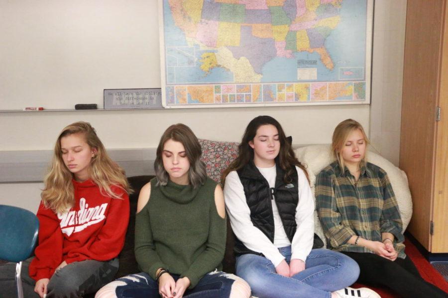 Theory of Knowledge (TOK) students work on their breathing meditation. Junior Aubrie Bradbury (second from the right) said she found out about mindfulness during her freshman year, but during TOK, she got back into practicing mindfulness, which has been helpful for her.