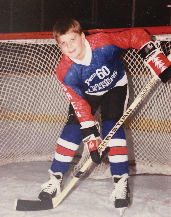 Science teacher Drew Grimes as a child, pictured posing for a team photo. Grimes played hockey through high school and currently plays on and adult league on Monday nights at the Carmel Ice Skadium.