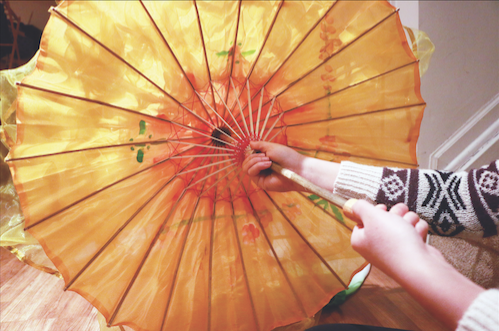 Su opens a traditional Chinese umbrella used for her ICCCI performances. Su said she performs annually at the New Year’s celebration.