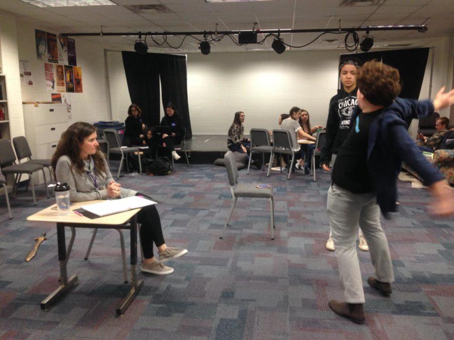 Maggie Cassidy, director of “Peter and the Starcatcher” and theatre arts teacher, watches members of the cast practice their scenes to ensure it is ready to piece together with the rest of the production. Cassidy said for the most part, the musical is ready for opening night.