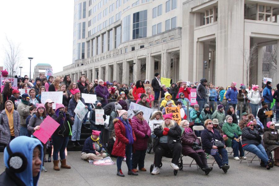 Women’s rights activists listen to a key speaker at the Indianapolis Women’s March, a sister rally of the Women’s March on Washington, at the Indianapolis Statehouse.