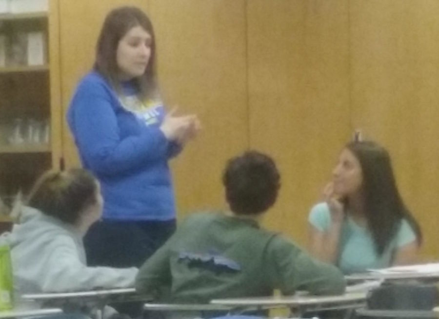 Club Med sponsor Alyssa Mastin talks with students in her principles of biomedical science class. She said, Biomed and Club Med are very different, but I enjoy them both because of their general similarities.