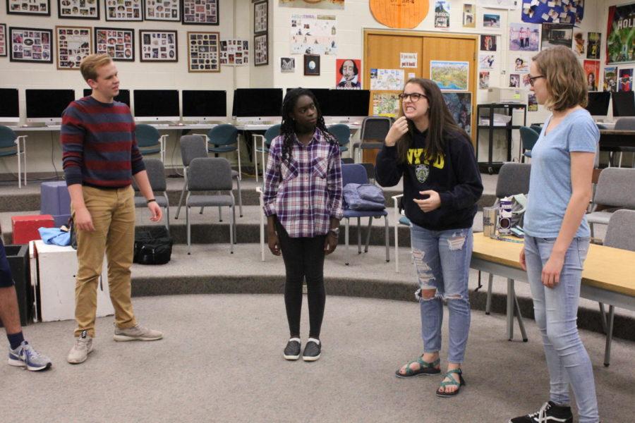 The ComedySportz team prepares for its upcoming matches by playing comedic improv games with an emphasis on physicality. In this game, Allie Crawford, ComedySportz member and junior, pretended to take out her dentures. 