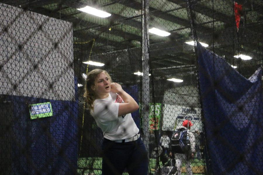 Sophomore+Olivia+Roop+hits+a+softball+in+the+Hittrax+sensor.+The+sensor+tracked+the+speed+of+her+hit%2C+the+angle+she+swung+her+bat+and+the+area+in+which+the+softball+would+have+traveled+if+on+a+real+field.+