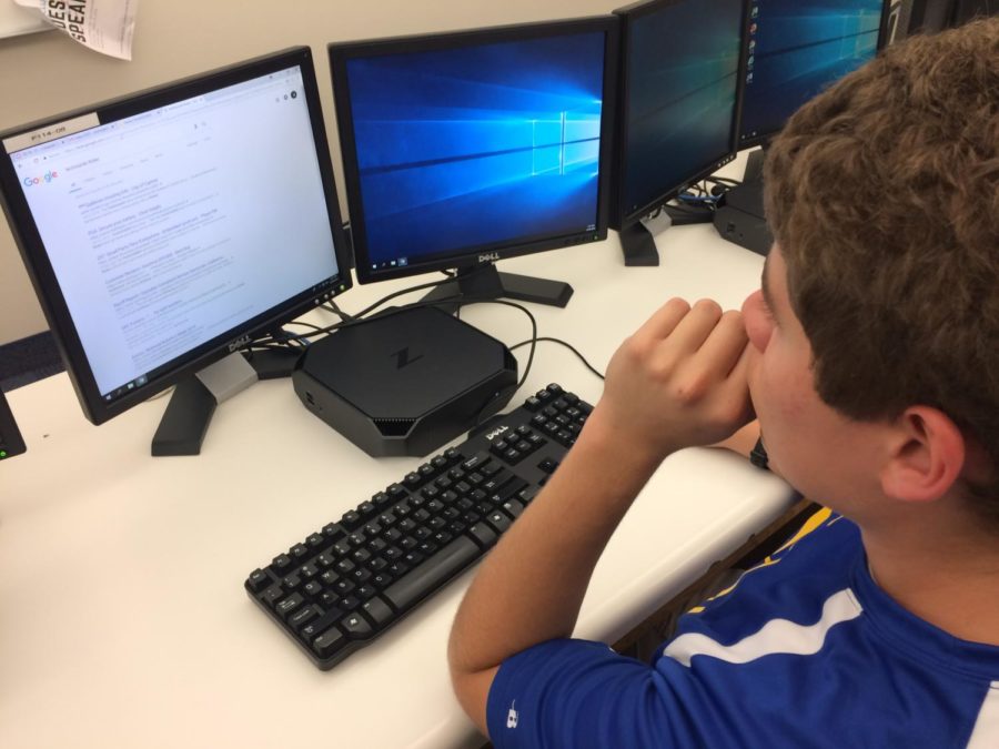 Derek Fronek, Robotics Design Lead and senior, reviews AP Computer Science notes. He said building a new team after the successful result from last year was very exciting.