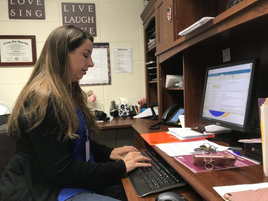 Director of Choirs Katherine Kouns responds to emails before school in her office on Sept. 12. Kouns said ¨Things are chugging along like usual, and the groups are pretty much where they should be in terms of progress.”