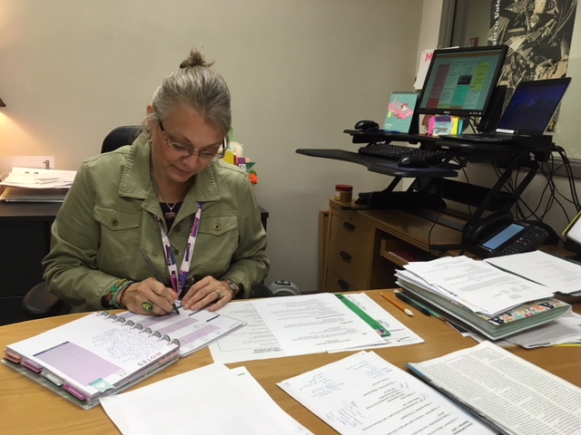 Terri Ramos, department chairperson for media and communications, looks through her calendar of events. “The media center is always busy,” Ramos said. “We have to stay organized and be on top of things.