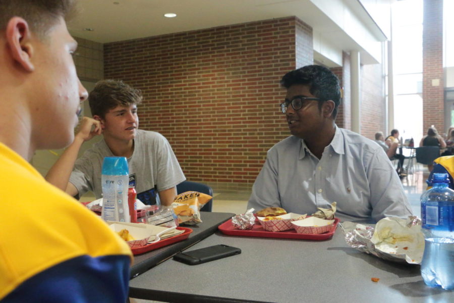 Rik Bag (right), Carmel Mayor’s Youth Council (CMYC) president and senior, talks with friends during lunch. Bag said, “CMYC is kind of like a mix of the best high schoolers in the entire community. It’s a really good environment to be able to speak your thoughts about whatever we’re discussing at that time.”