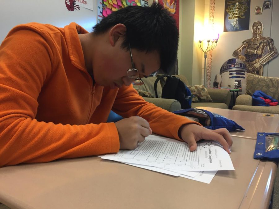 Math Club member and freshman Austin Guo works on a practice worksheet for the Mandelbrot competition. The Mandelbrot is a five-round math competition, with each round getting consecutively harder. 