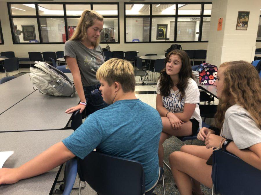 Best Buddies club members Anne Schuh, Sky Simpson, Molly Shaffer and Melissa Settle chat after the second call-out meeting. The club had two call-out meetings for this year, with in total over 150 students attending.