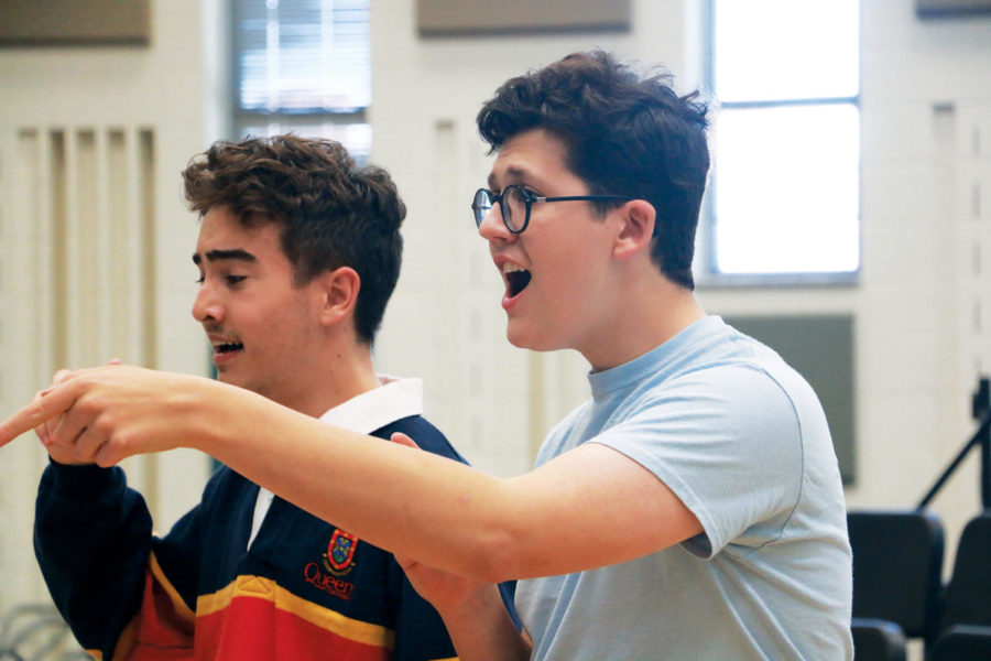 Performer and sophomore Jack Ducat (right) and performer and senior Chase LaPlante (left) practice during rehearsal. Performers have three weeks less of rehearsal than they did for “The Little Mermaid.”