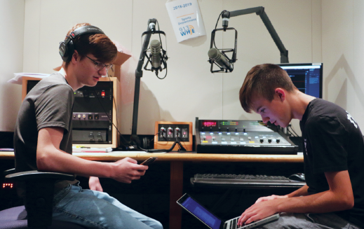 Rapper and sophomore Isaac Brown (left) prepares to record his new songs alongside DJ and sophomore Ethan Meneghini (right) in one of the school’s recording studios during late start. This was the first time the pair had worked together. Both Brown and Meneghini said they were excited to begin working.
