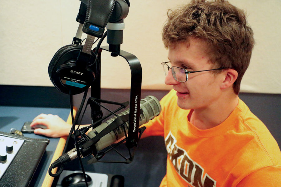 Radio Recording:
Senior Ethan Wakeman talks into his microphone during a recording session at the CHS recording lab. He said radio is a fun way to express himself.