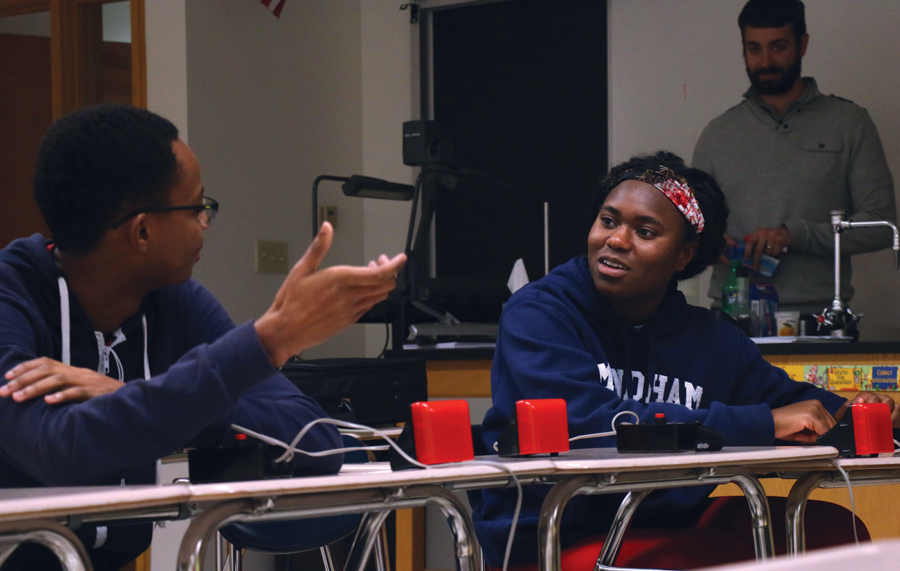 Jeopardy competitor and senior Audrey Satchivi deliberates with Andrew Sleugh, Quiz Bowl teammate and senior. Satchivi uses her experience on Jeopardy to compete in Quiz Bowl.