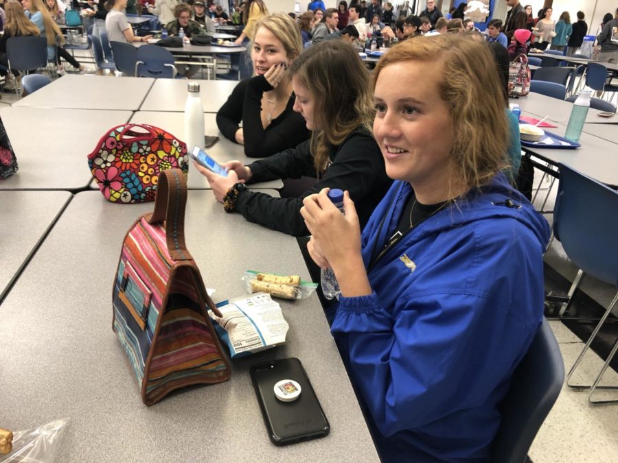 Melissa Settle, Best Buddies Club officer and senior, chats with her friend during lunch. This year is Settle’s fourth year in the club, and she said the SRT Christmas caroling has been a well-liked event in previous years.