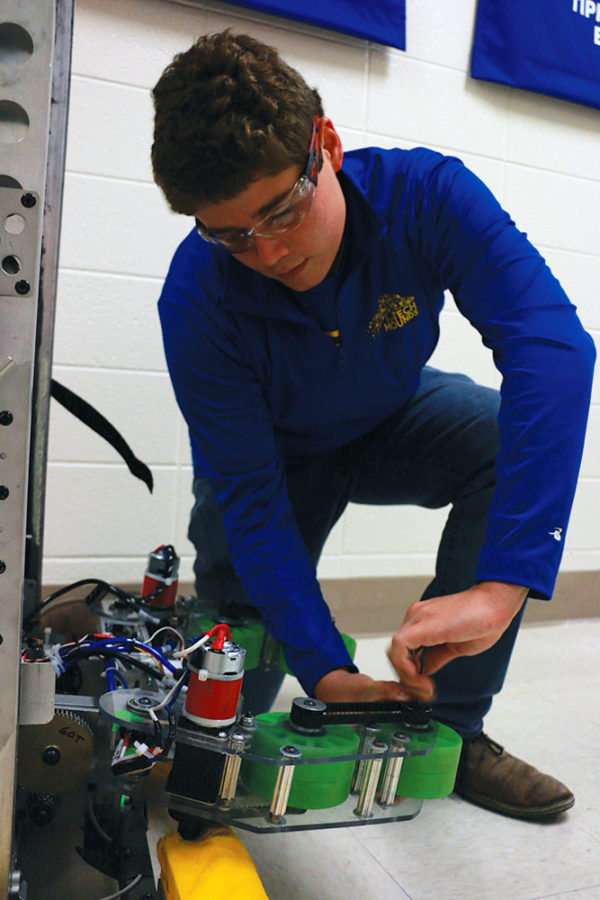 ROBOT MANIA:
Derek Fronek, TechHOUNDS Robot Operations Lead and senior, works on intake system for 2018 robot ‘Quickdraw.’ TechHOUNDS has many aspects to the development of its robots, including programming.