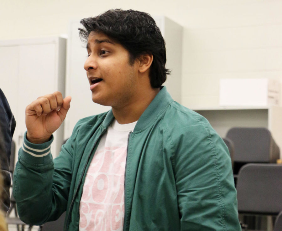 Nathan Aditya, Select Sound member and senior, rehearses one of the many popular Christmas songs that Select Sound has prepared for the holiday season. They will sing these carols throughout December for their caroling and in Holiday Spectacular­—the annual festive concert that all of the choirs participate in