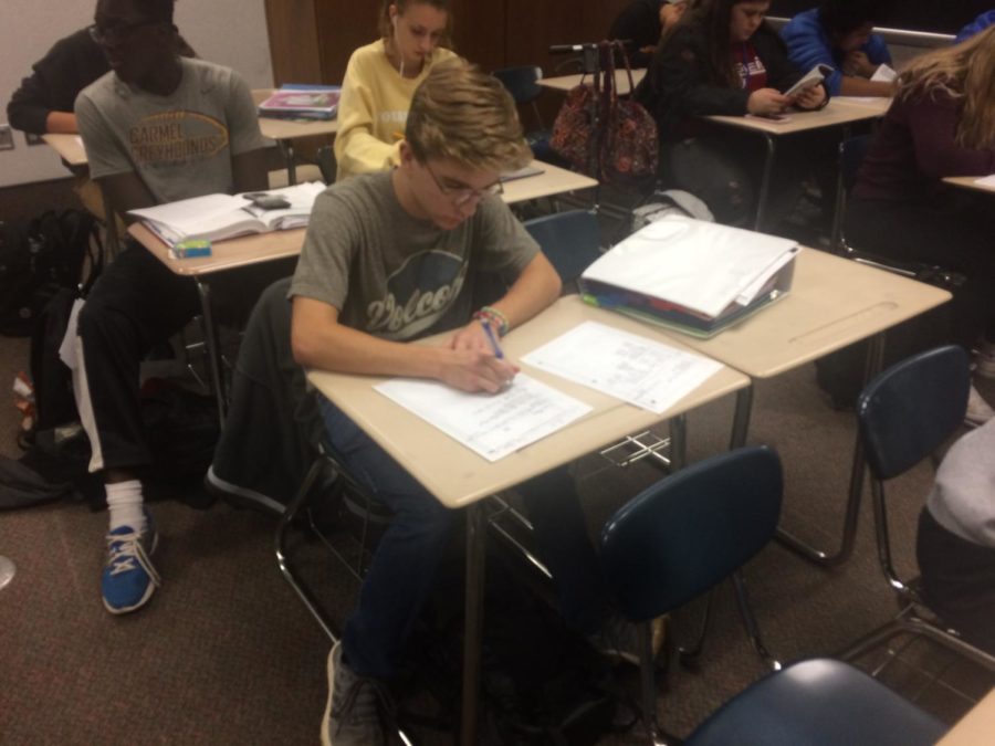Junior Cameron Milam works on an assignment for AVID. He said he believes AVID can be very helpful for his future. “It teaches me how to ask questions, how to answer those questions and how to prepare for college and my future,” Milam said.
