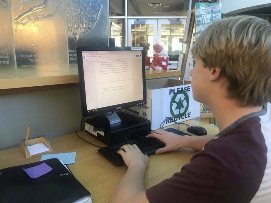 Sophomore John “Evan” Mickel works on his English paper. Mickel said he preferred using the PowerSchool app over myCCS since his freshman year.