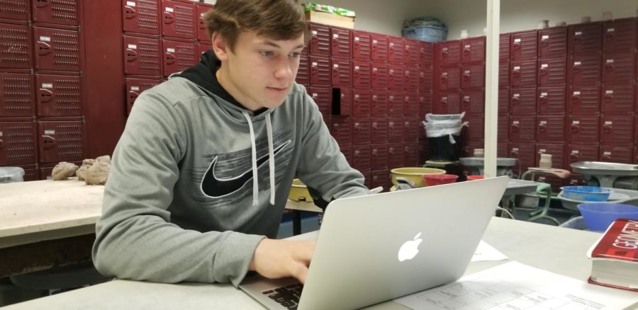 Thomas Gastineau, student leader of CRU Club and senior, works quietly on his laptop during SRT. Members of CRU Club will be attending Fastbreak, a leadership conference, over Martin Luther King Jr. Day weekend.