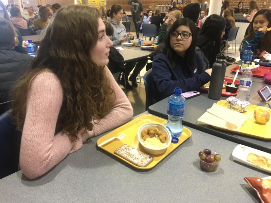 Sarah Konrad, TEDx member and sophomore, talks to her friends while eating lunch in Greyhound Station. She said she is sad that social studies teacher Allison Hargrove is no longer the TEDx sponsor, as she always talked to all the club members and had a positive effect on the club.