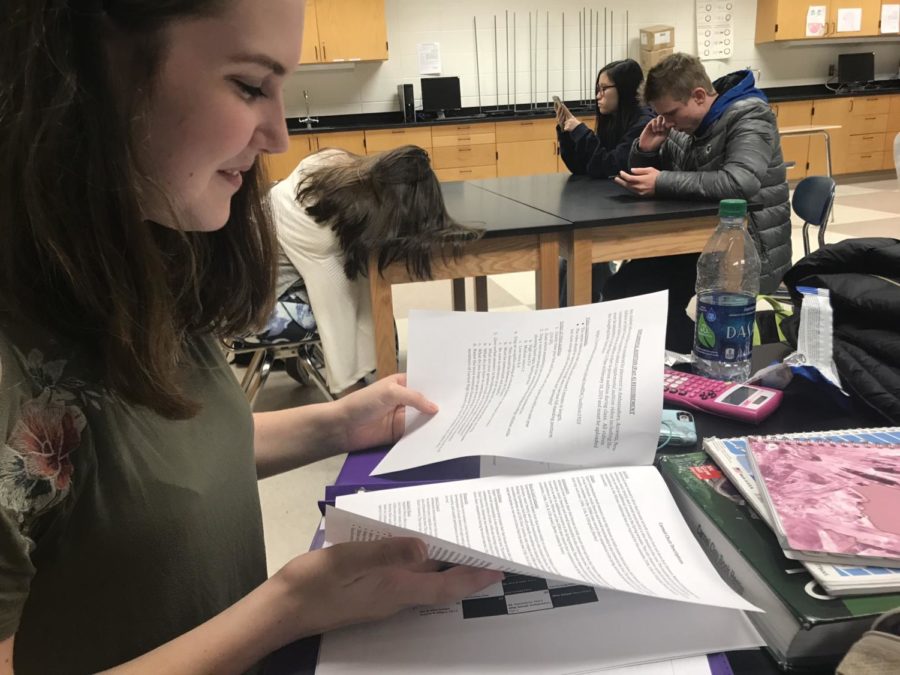 Lindsay Vrobel, Rhapsody member and sophomore, reviews the choir audition schedule during SRT on Jan. 10. Vrobel auditioned for New Edition.