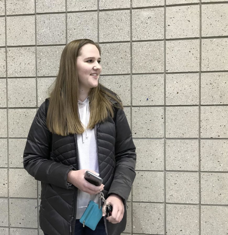 Co-president and senior Emily Elzinga grabs her keys during passing period. According to Elzinga, Champions Together had their first meeting for Mr. Carmel in December to begin to choose the boys and judges for the event.