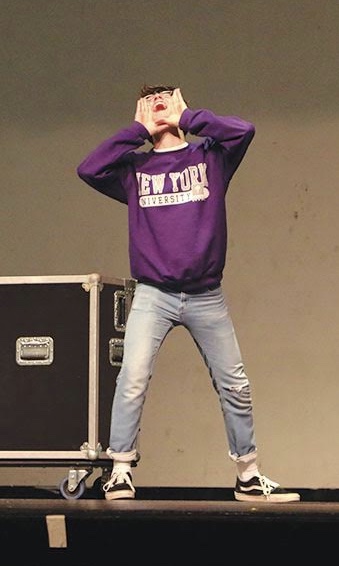 Austin Audia, cast as Aladdin and sophomore, rehearses on stage. He said he loves how the actors are supposed to appeal to a child-friendly audience, so they over animate all of their actions. He also said his favorite part of performing is putting on a new personality in front of an audience.